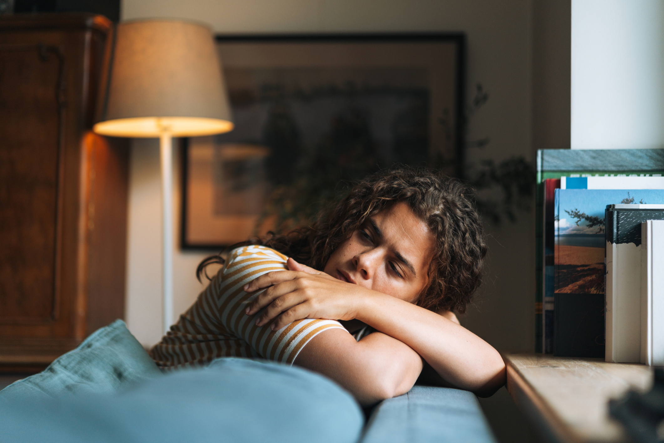 woman resting on couch